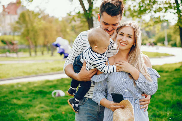 beautiful family in a park - Фото, изображение
