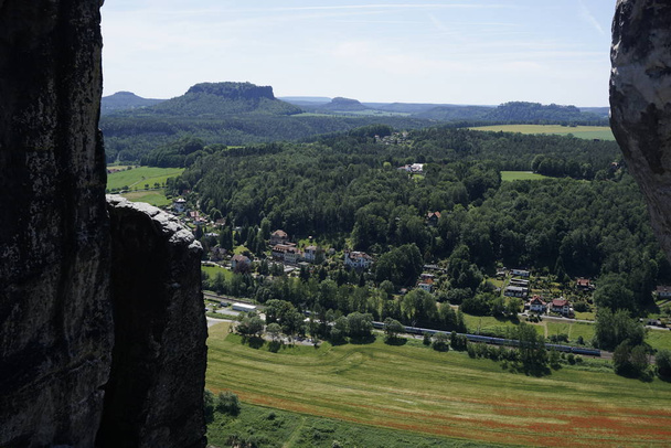 View from the Bastei bridge over several peaks of Saxon Switzerland - Photo, Image