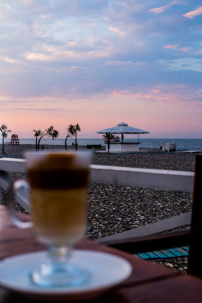 photo of a drink in defocus on the background of the sea - Photo, Image
