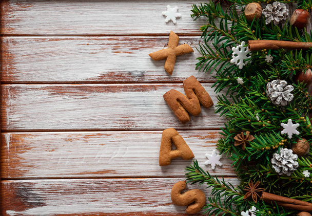 Gingerbread words Merry Christmas on the wooden background - Fotografie, Obrázek