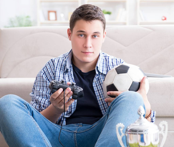 Young man playing computer games at home - Photo, Image