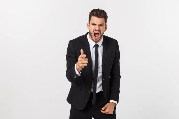 young handsome man shouting aggressively, looking very angry, frustrated, outraged or annoyed, screaming. Isolated over white background. - Fotó, kép