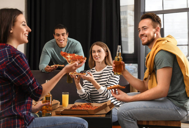 Group of friends having fun party with delicious pizza in cafe - Photo, Image