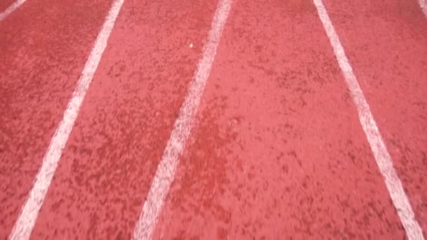 Slow Motion Pov Correndo ao longo de uma pista de atletismo
. - Filmagem, Vídeo