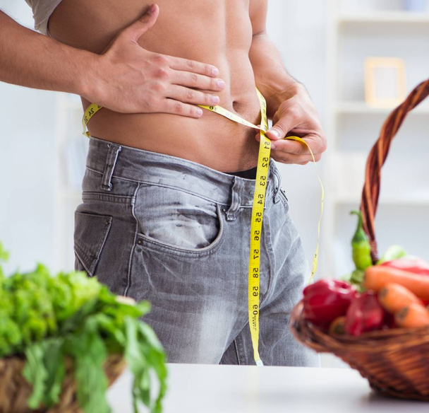 The young man in healthy eating and dieting concept - Foto, imagen