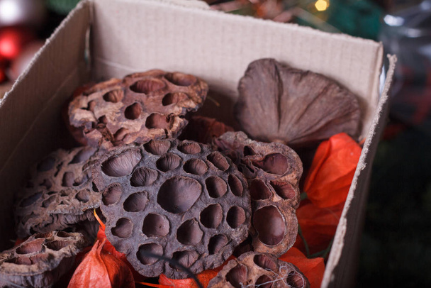 Close-up of homemade box with decorative details for decorating bouquets and wreaths, selective focus - Photo, Image
