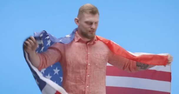 Young man dancing and holding US flag - Footage, Video