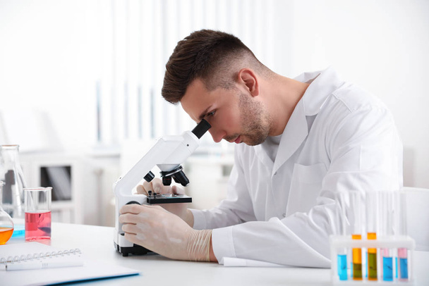 Scientist using modern microscope at table. Medical research - Foto, Bild