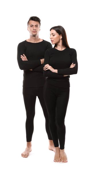 Couple wearing thermal underwear isolated on white - Foto, afbeelding