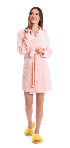 Young woman in bathrobe on white background - Foto, Imagem