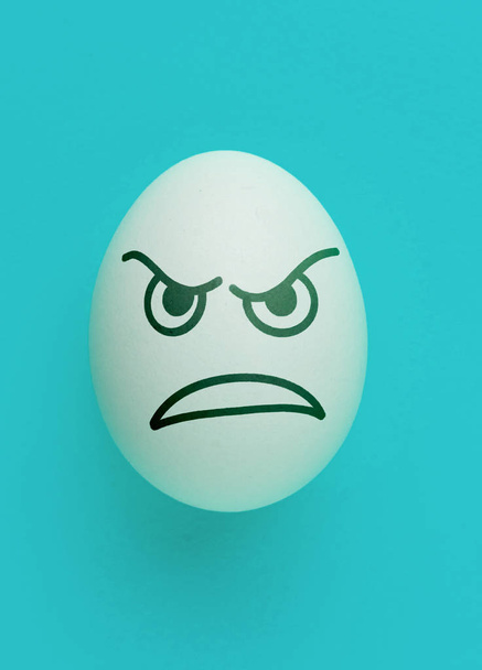 evil scary angry face emotion painted on the easter egg, halloween concept - Photo, Image