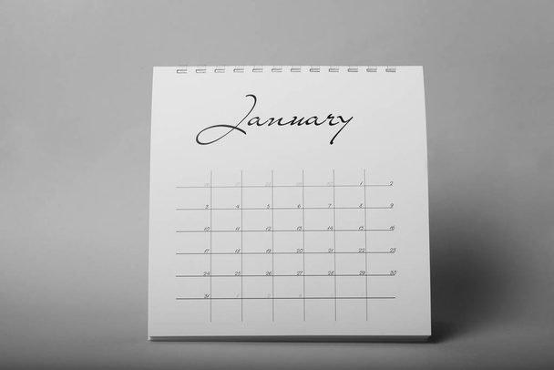 Paper calendar on grey background. Planning concept - Фото, изображение