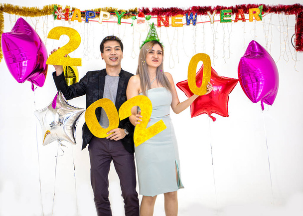 Asian couple lover holding 2020 numbers celebrating a new year a - Photo, Image