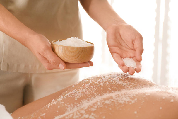 Young woman having body scrubbing procedure with sea salt in spa - Φωτογραφία, εικόνα
