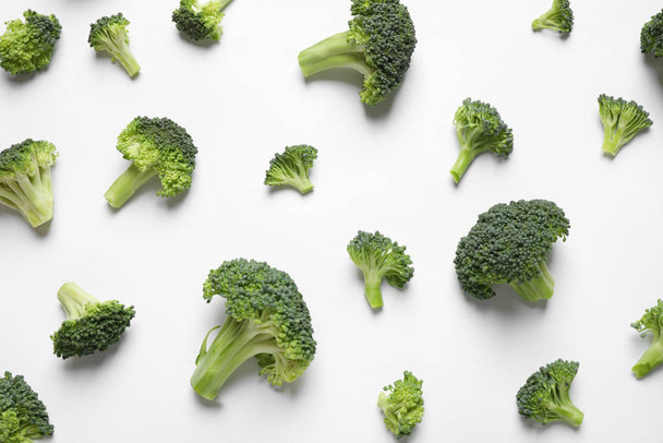 Fresh tasty broccoli on white background, top view - Foto, Bild