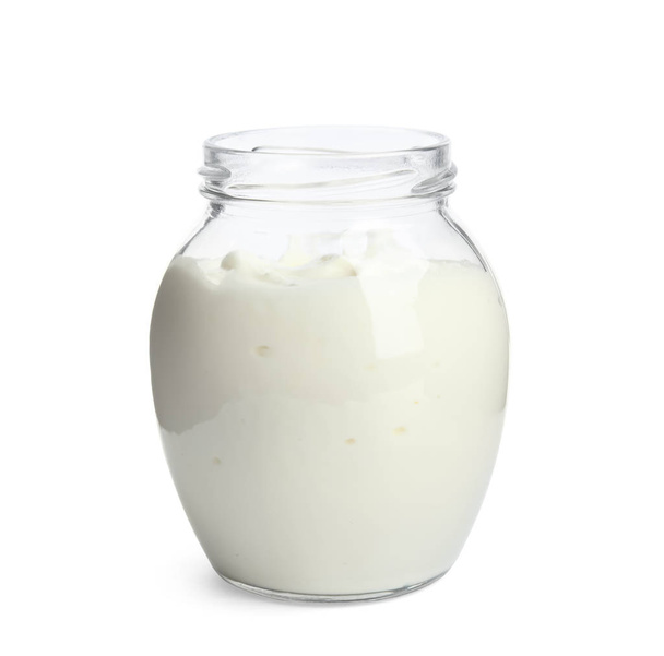 Tasty organic yogurt in glass jar isolated on white - 写真・画像
