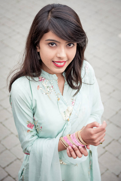 Chudiyan. Bracelets on the girl's hands. Traditional accessories of Indian girls. Girl in traditional Indian clothing, salwar kameez. - Photo, Image