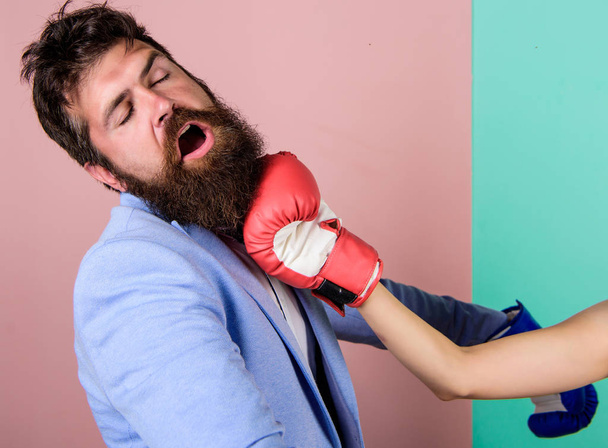 bearded man hipster defeated by woman. businessman failed. knockout punching. who is right. Strength and power. family life. woman boxing glove beat man. problems in relationship. sport - Fotoğraf, Görsel