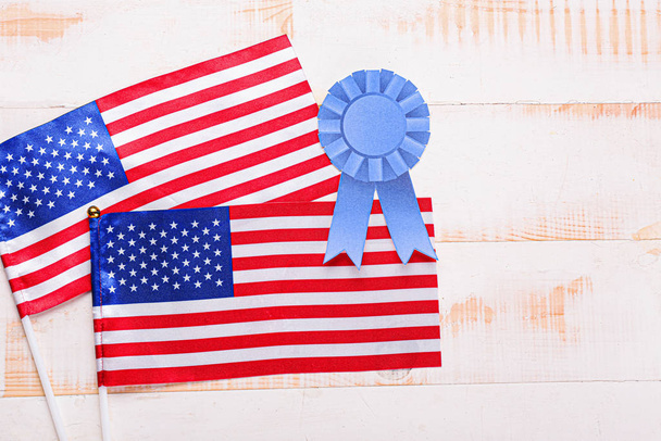 USA flags and emblem on wooden background. Memorial Day celebration - Photo, Image