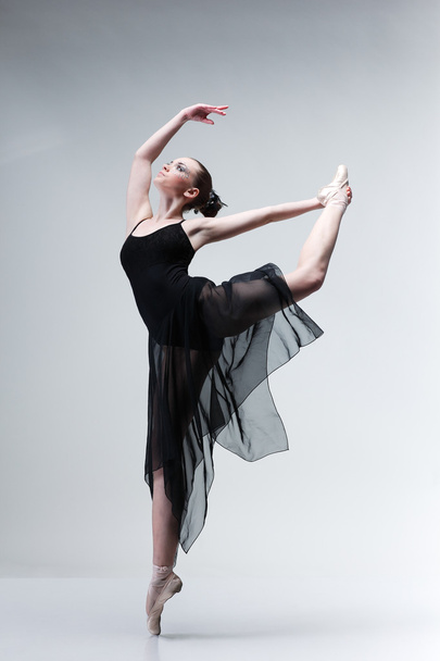 Beautiful ballet-dancer, modern style dancer posing on studio background - Foto, afbeelding