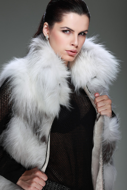 A photo of sexual beautiful girl is in fashion style is in fur clothes - Φωτογραφία, εικόνα