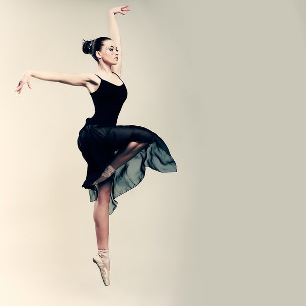 Beautiful ballet-dancer, modern style dancer posing on studio background - Photo, image