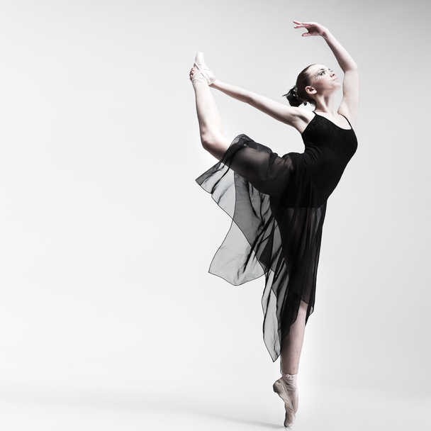 Beautiful ballet-dancer, modern style dancer posing on studio background - Фото, зображення
