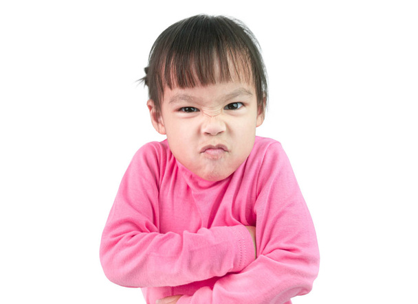 Retrato de niña enojada y de pie con cruz '
 - Foto, Imagen