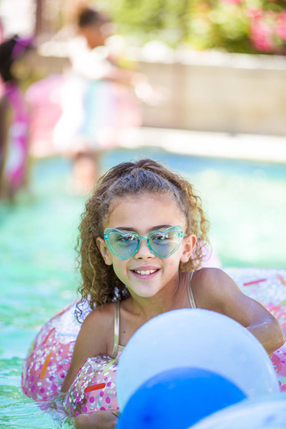 Summer fun cute little girl on inflatable - Fotografie, Obrázek
