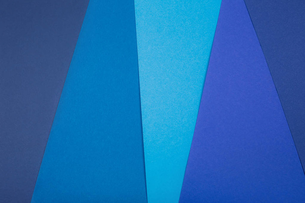 Divided in several parts blue paper background - Foto, Bild