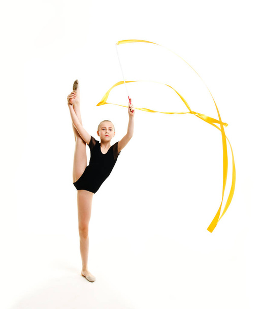 Flexible cute little girl child gymnast doing acrobatic exercise - Zdjęcie, obraz