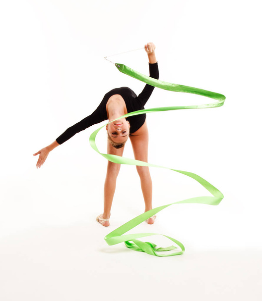 Flexible cute little girl child gymnast doing acrobatic exercise - Foto, imagen