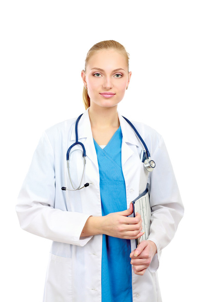 Smiling young doctor in white coat standing - Фото, изображение
