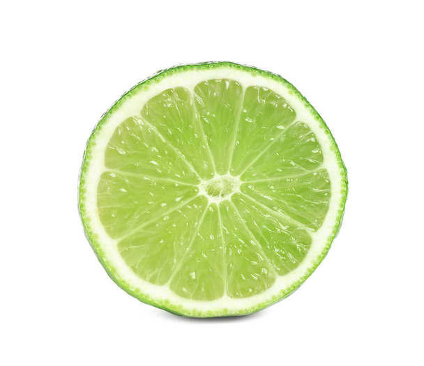 Cut fresh ripe lime isolated on white - 写真・画像