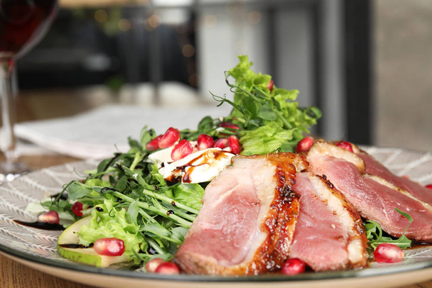Delicious salad with roasted duck breast on plate, closeup - Photo, Image