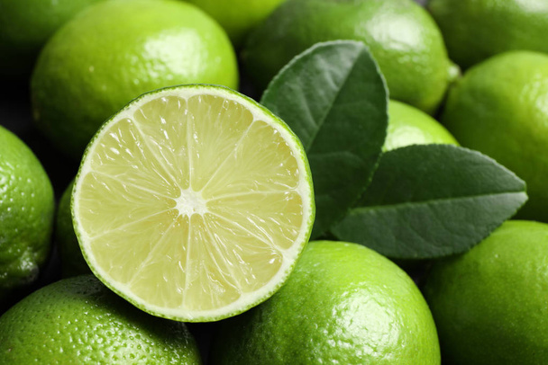 Fresh ripe juicy limes as background, closeup - Foto, Imagem