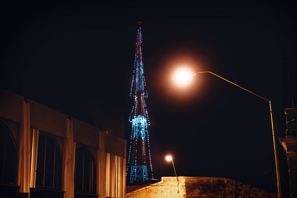 Transmitter tower decorated as christmas tree with colonial buildings and street lights , Merida, Yucatan, Mexico - Photo, Image
