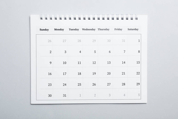 Paper calendar on light grey background, top view - Photo, image