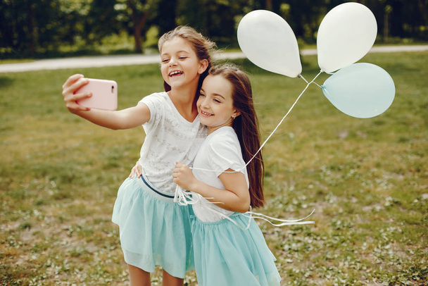 cute girls with ballons - 写真・画像
