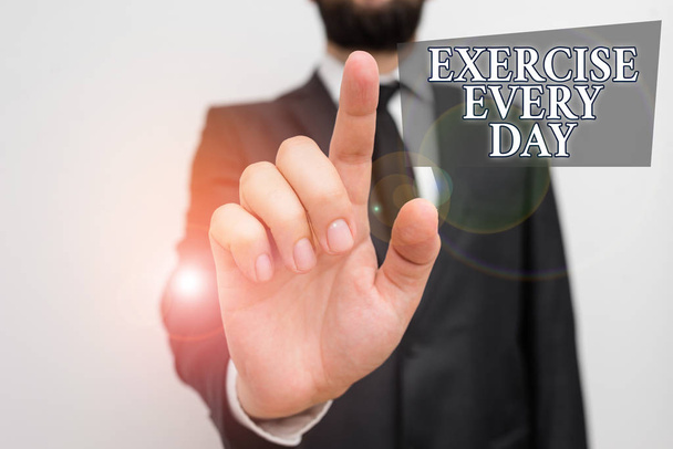 Conceptual hand writing showing Exercise Every Day. Business photo showcasing move body energetically in order to get fit and healthy Male human with beard wear formal working suit clothes hand. - Photo, Image