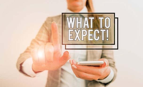 Text sign showing What To Expect. Conceptual photo asking about regard something as likely to happen occur Business concept with mobile phone and business woman. - Photo, Image