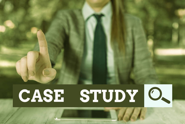 Text sign showing Case Study. Conceptual photo research methodology that has commonly used in social sciences Female business person sitting by table holding mobile phone. - Photo, Image