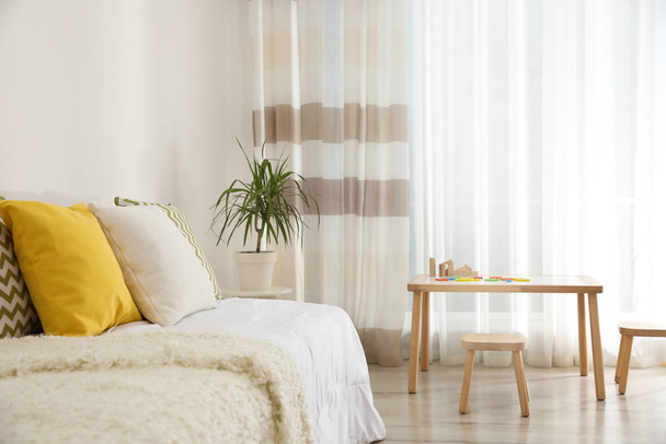 Modern child room interior with comfortable bed - Фото, зображення