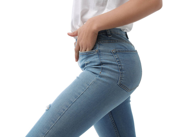 Woman wearing jeans on white background, closeup - Foto, afbeelding