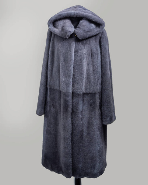 Mink coat gray with gradation of one color, undercut yoke for the store catalog - Photo, Image