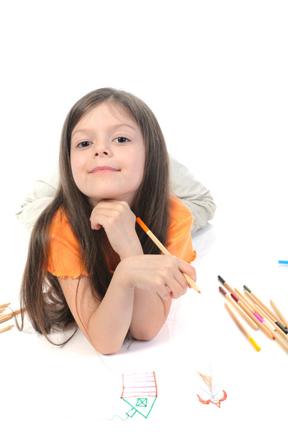 Little beautiful girl draws pencil on paper. - Foto, afbeelding