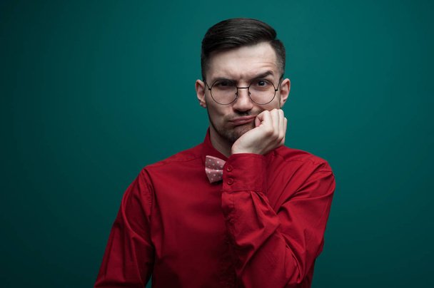 Portrait of an upset young man with glasses - Fotografie, Obrázek