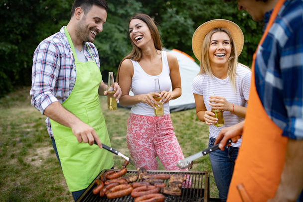 Group of young friends having barbecue party, outdoors - Foto, Imagem