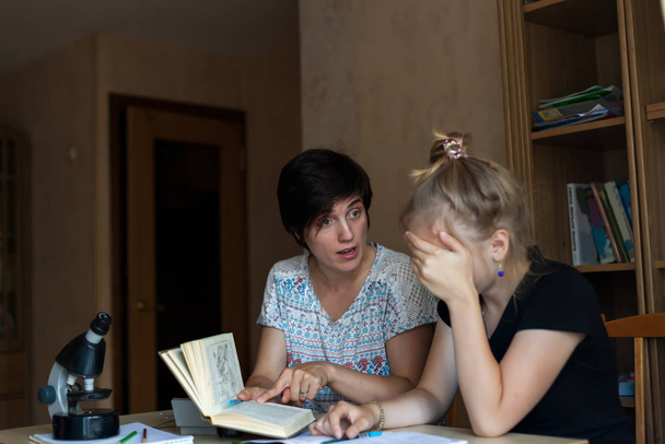 teenage girl taking offense at her mother for studying . - Photo, Image