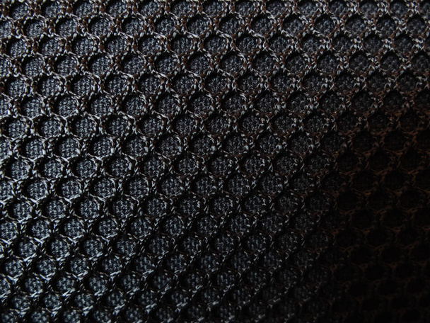 Black textile furniture upholstery mesh. Background textured seamless pattern - 写真・画像